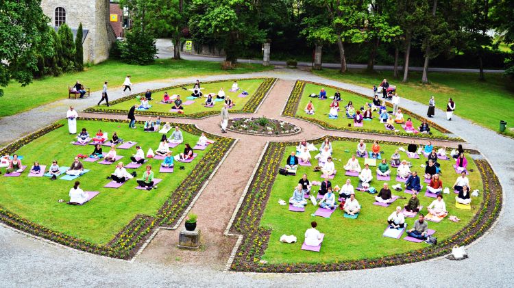 Yoga on the lawn at Radhadesh