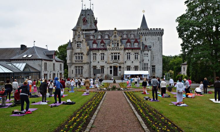 Yoga in front of the Radhadesh castle