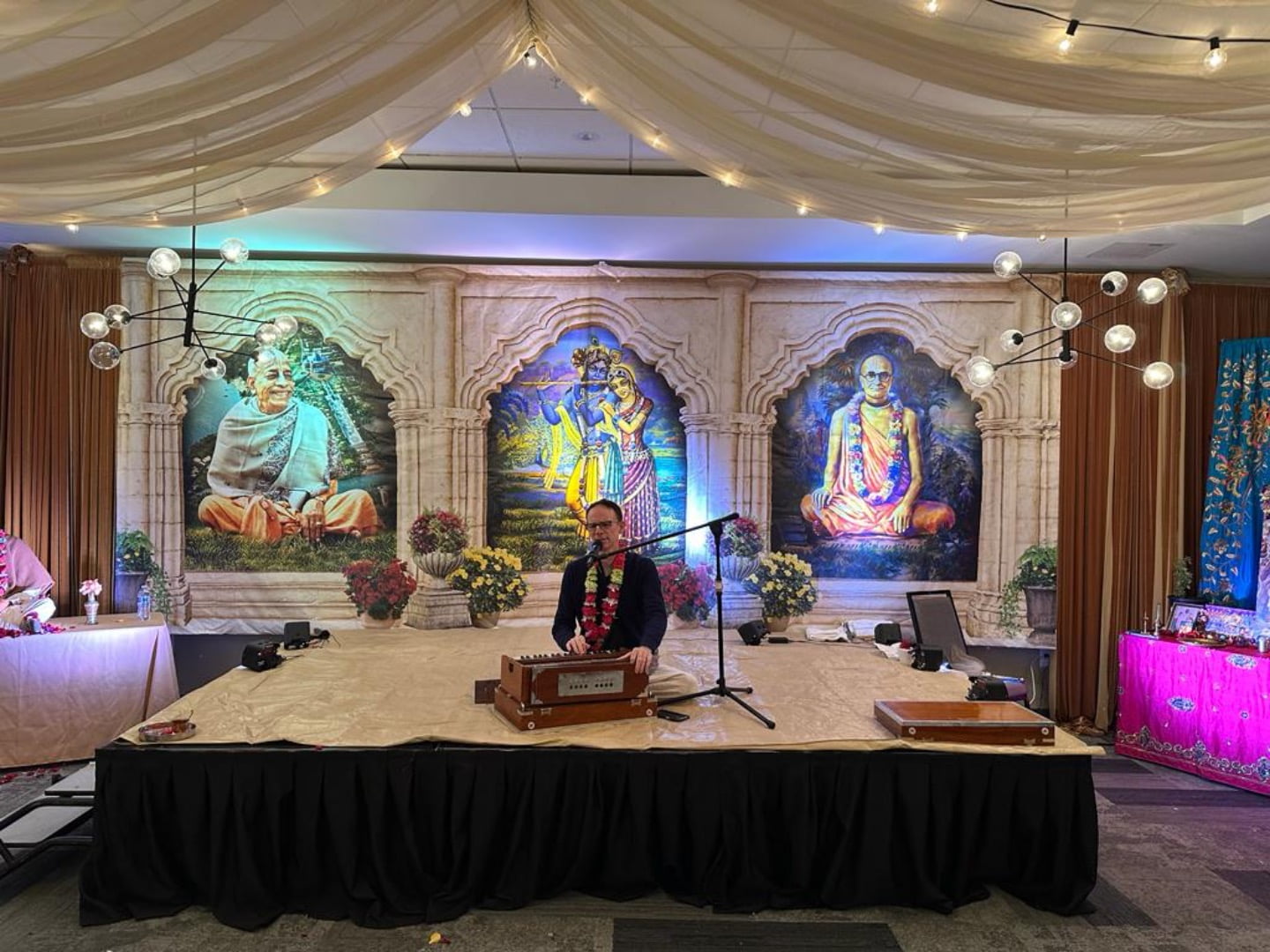 A hotel room transformed into Navadvip Dham; Sri Prahlad Das leading kirtan.